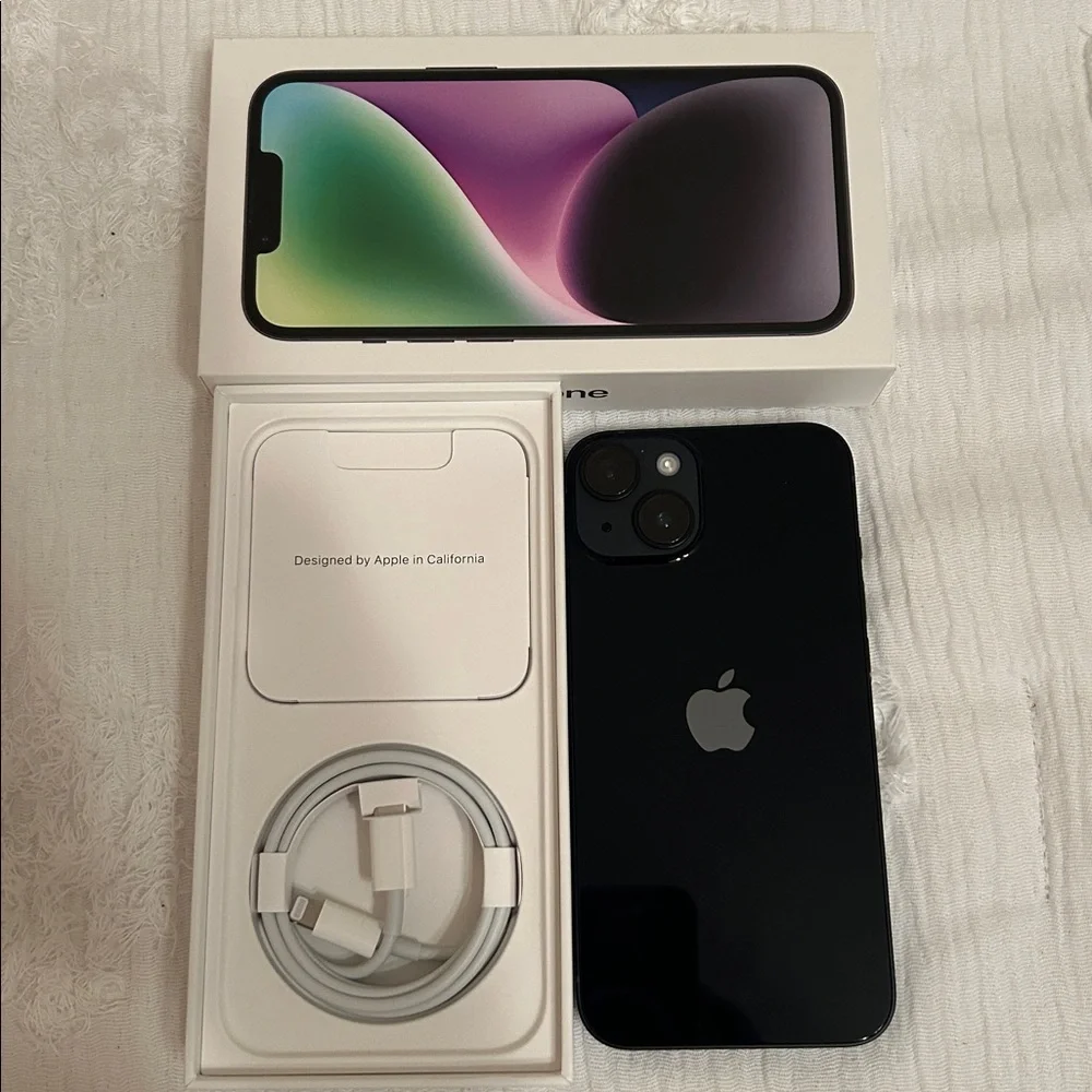Apple iPhone with Black Screen and White Packaging